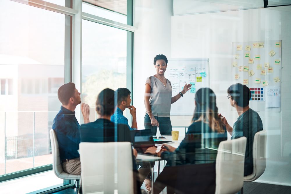 Shot of a group of businesspeople having a meeting in a modern office