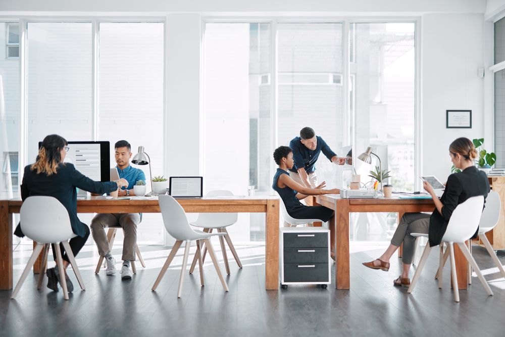 Shot of a team of businesspeople working together in a modern office