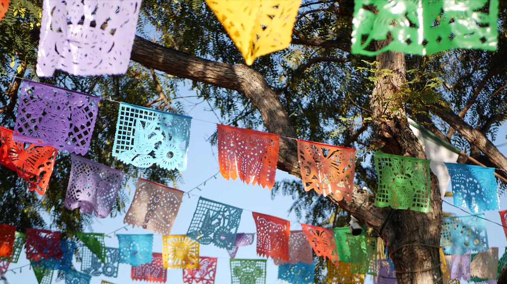 Colorful Mexican perforated papel picado banner, festival colorful paper garland.