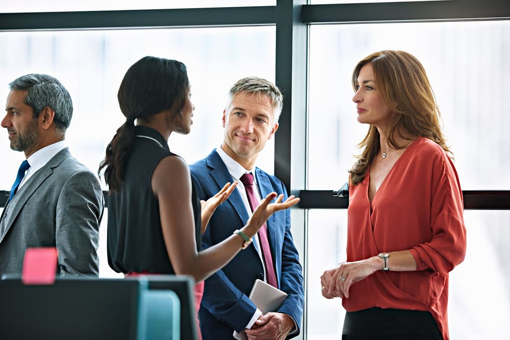 Business people chatting before the meeting