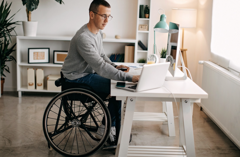 Man on wheelchair taking digital learning course