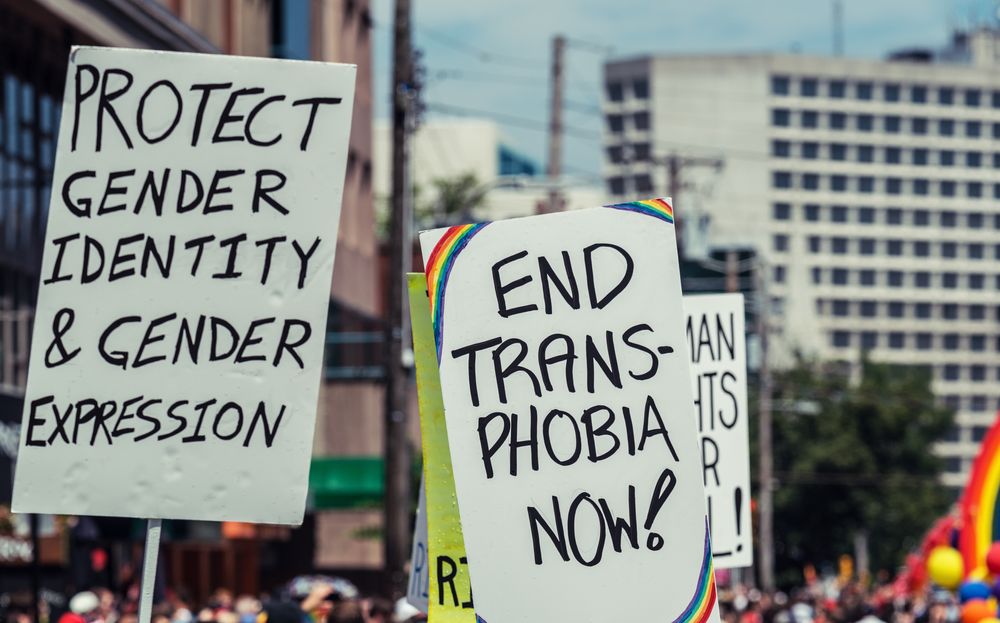 End transphobia now, protect gender identity & gender expression demonstration signs