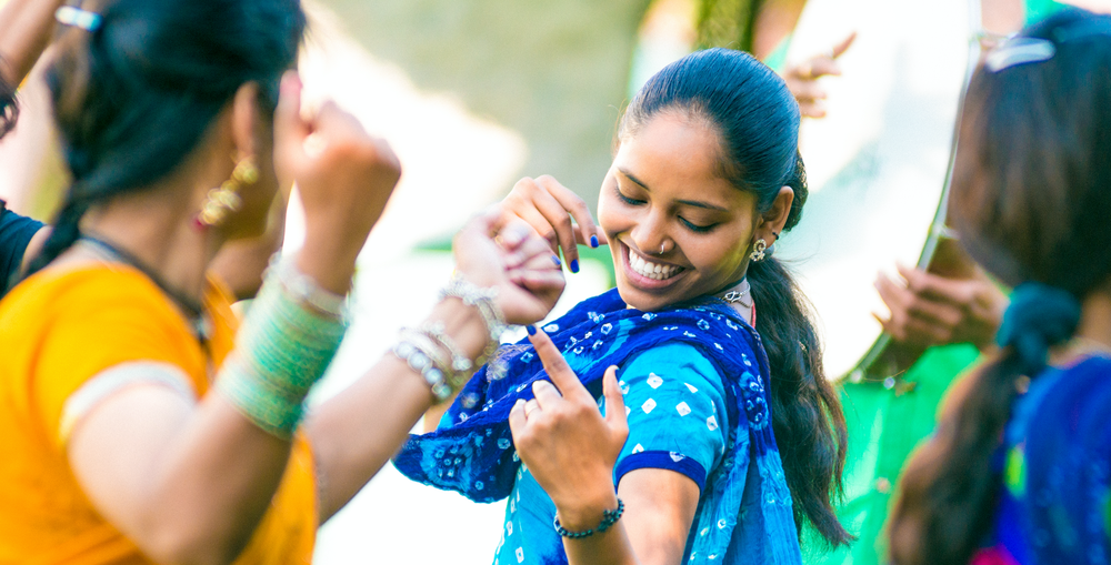 Woman wearing a blue sari dancing