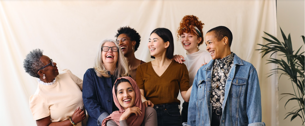 Portrait of cheerful mixed age range multi ethnic women celebrating International Women's Day stock photo