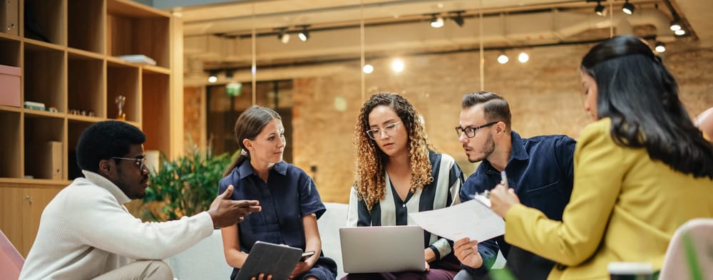 Diverse team collaborates in office