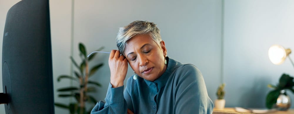 A woman considers advocating for mental health at work