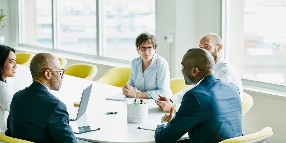 Group of businesspeople in team meeting in office conference room