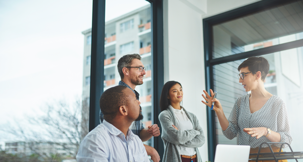 Shot of a diverse group of colleagues having a discussion in a modern office