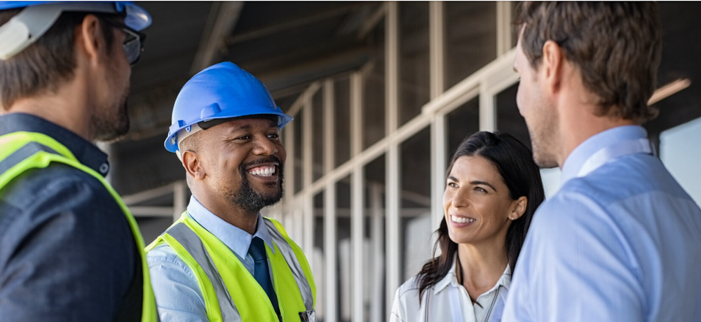 Construction worker meeting with others