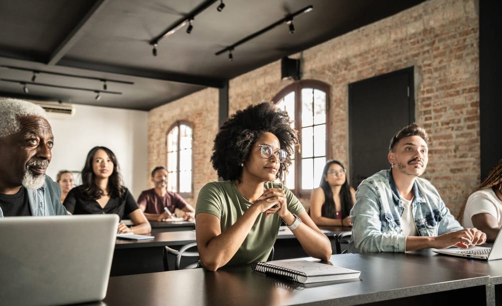 A diverse group of employees engage in professional development