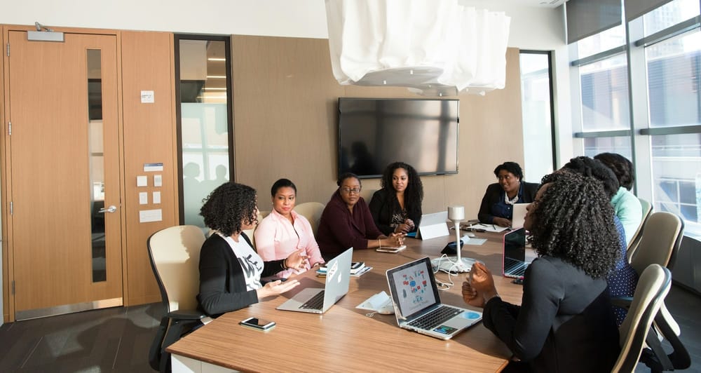 Black women at a conference table