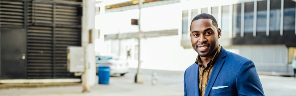 Black man in blue business suit