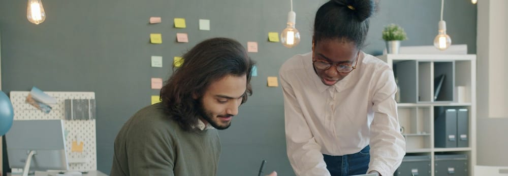 Two employees discuss belonging